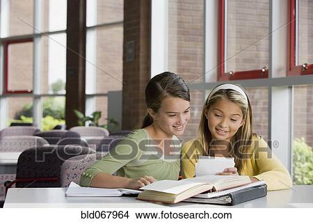 Picture - Girls doing homework. Fotosearch