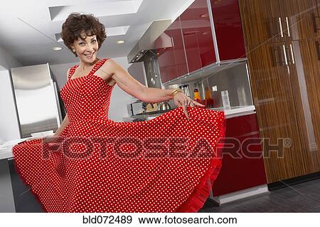 Glamorous mixed race woman posing in kitchen View Large Photo Image Stock Photo - Glamorous mixed race woman posing in kitchen. Fotosearch