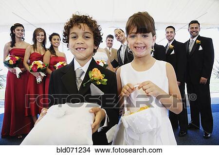 Hispanic boy and girl as ring bearer and flower girl View Large Photo Image Picture - Hispanic boy and girl as ring bearer and flower girl. Fotosearch