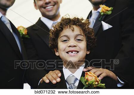 Stock Image - Hispanic boy wearing tuxedo. Fotosearch