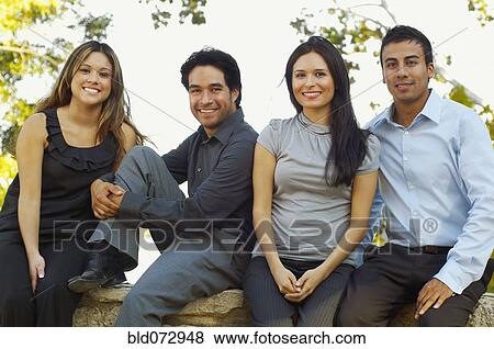 Stock Photo - Hispanic business people posing outdoors. Fotosearch