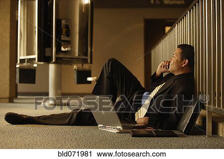 Hispanic businessman talking on cell phone View Large Photo Image Stock Image - Hispanic businessman talking on cell phone. Fotosearch