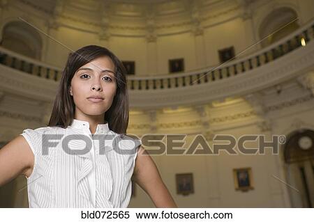 Stock Photography - Hispanic businesswoman in capitol building. Fotosearch