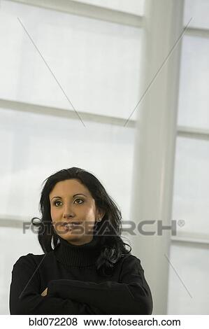 Hispanic businesswoman looking pensive View Large Photo Image Stock Photo - Hispanic businesswoman looking pensive. Fotosearch