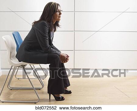 Hispanic businesswoman sitting in waiting room View Large Photo Image Stock Image - Hispanic businesswoman sitting in waiting room. Fotosearch