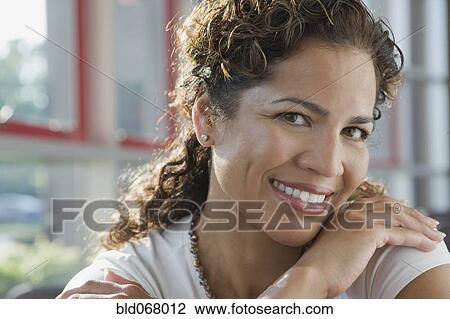 Stock Image - Hispanic businesswoman smiling. Fotosearch