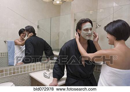 Stock Photo - Hispanic couple in bathroom. Fotosearch
