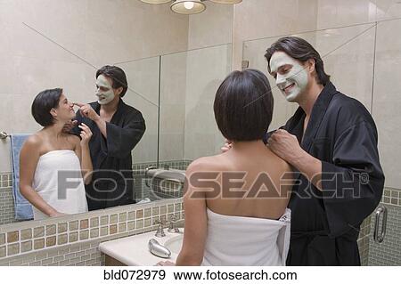 Stock Photo - Hispanic couple in bathroom. Fotosearch