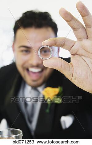 Hispanic groom showing ring View Large Photo Image Stock Image - Hispanic groom showing ring. Fotosearch
