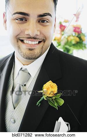 Stock Image - Hispanic man wearing tuxedo. Fotosearch