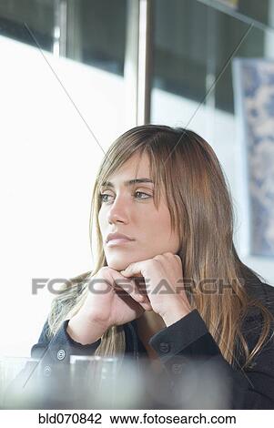 Hispanic woman looking out window View Large Photo Image Stock Image - Hispanic woman looking out window. Fotosearch