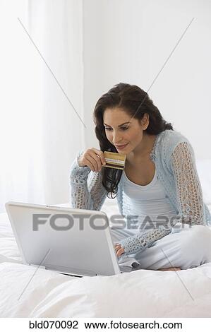 Hispanic woman shopping online View Large Photo Image Stock Image - Hispanic woman shopping online. Fotosearch