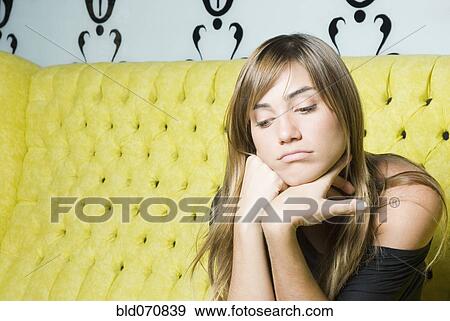 Hispanic woman with head in hands looking down View Large Photo Image Stock Photo - Hispanic woman with head in hands looking down. Fotosearch