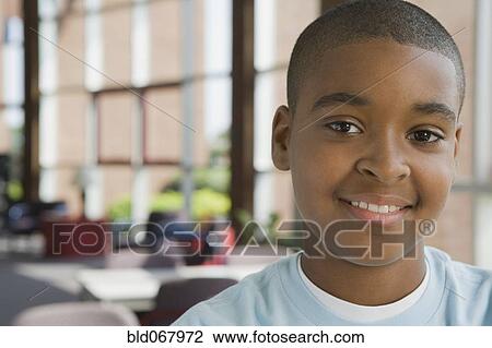 Mixed race boy in classroom View Large Photo Image Stock Image - Mixed race boy in classroom. Fotosearch