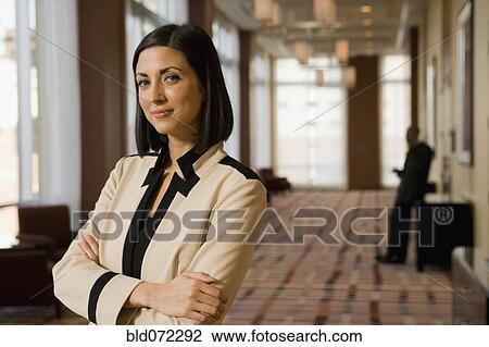 Stock Image - Mixed race businesswoman looking confident. Fotosearch
