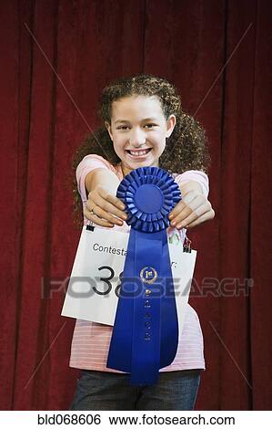 Stock Photograph - Mixed race girl competing in spelling bee. Fotosearch