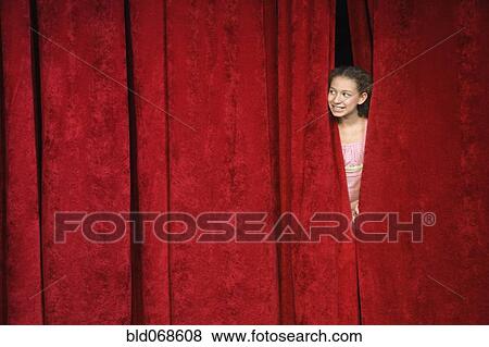 Mixed race person hiding behind stage curtain View Large Photo Image Stock Photo - Mixed race person hiding behind stage curtain. Fotosearch