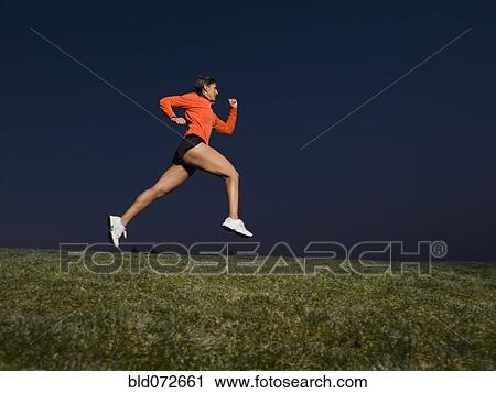 Mixed race woman running on grass View Large Photo Image Stock Image - Mixed race woman running on grass. Fotosearch