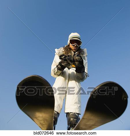 Mixed race woman skiing View Large Photo Image Stock Photograph - Mixed race woman skiing. Fotosearch