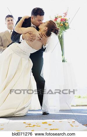 Multi-ethnic bride and groom kissing View Large Photo Image Stock Photograph - Multi-ethnic bride and groom kissing. Fotosearch