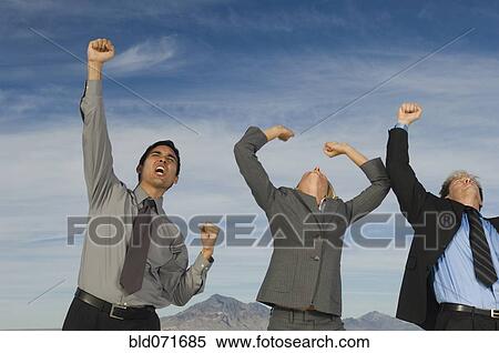 Multi-ethnic businesspeople cheering View Large Photo Image Stock Photography - Multi-ethnic businesspeople cheering. Fotosearch
