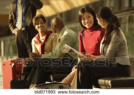 Stock Image - Multi-ethnic businesspeople talking. Fotosearch
