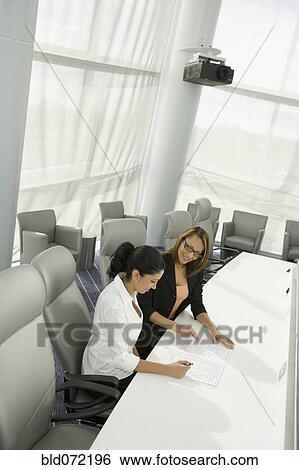 Multi-ethnic businesswomen in meeting View Large Photo Image Stock Photograph - Multi-ethnic businesswomen in meeting. Fotosearch