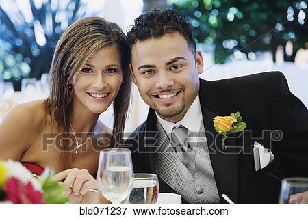 Stock Photo - Multi-ethnic couple at wedding. Fotosearch