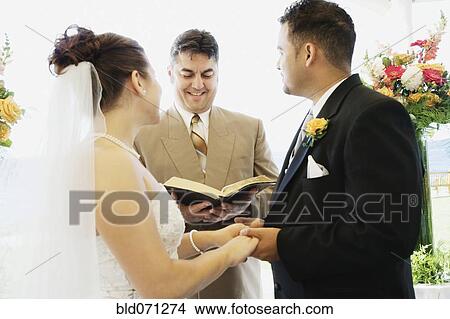 Multi-ethnic couple getting married View Large Photo Image Picture - Multi-ethnic couple getting married. Fotosearch
