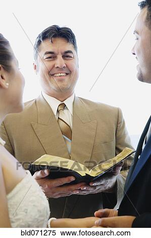 Multi-ethnic couple getting married View Large Photo Image Stock Photography - Multi-ethnic couple getting married. Fotosearch