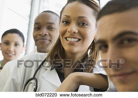 Multi-ethnic doctor and nurses posing View Large Photo Image Stock Image - Multi-ethnic doctor and nurses posing. Fotosearch