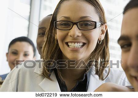 Multi-ethnic doctor and nurses smiling View Large Photo Image Stock Photo - Multi-ethnic doctor and nurses smiling. Fotosearch