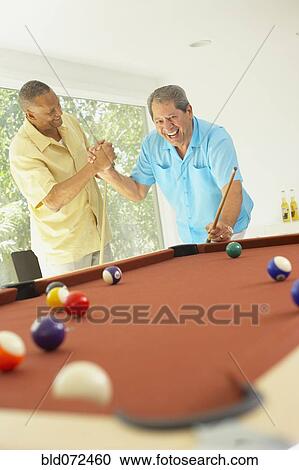 Multi-ethnic friends playing pool View Large Photo Image Stock Image - Multi-ethnic friends playing pool. Fotosearch