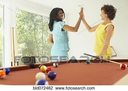Multi-ethnic friends playing pool View Large Photo Image Stock Image - Multi-ethnic friends playing pool. Fotosearch
