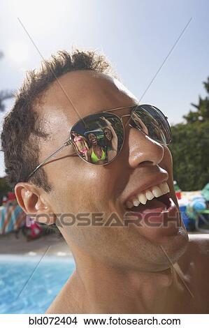 Multi-ethnic group of friends enjoying pool party View Large Photo Image Picture - Multi-ethnic group of friends enjoying pool party. Fotosearch