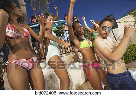 Multi-ethnic group of friends enjoying pool party View Large Photo Image Stock Photo - Multi-ethnic group of friends enjoying pool party. Fotosearch