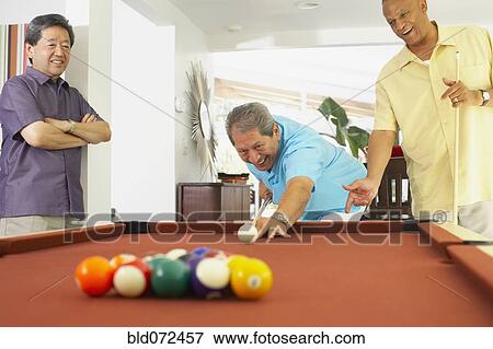 Multi-ethnic group of friends playing pool View Large Photo Image Stock Photo - Multi-ethnic group of friends playing pool. Fotosearch