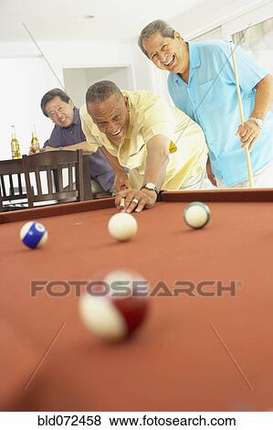 Multi-ethnic group of friends playing pool View Large Photo Image Stock Photo - Multi-ethnic group of friends playing pool. Fotosearch