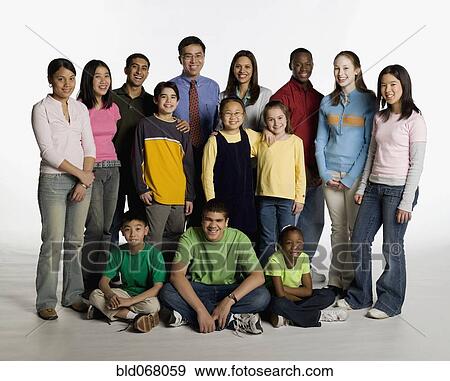 Multi-ethnic teacher and students posing View Large Photo Image Stock Photo - Multi-ethnic teacher and students posing. Fotosearch