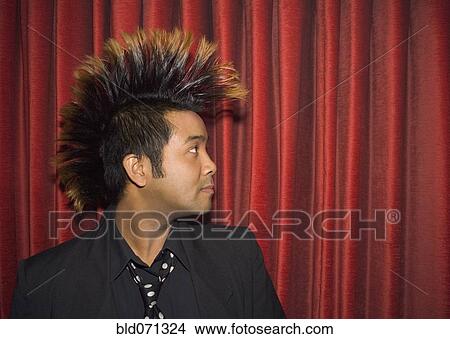 Picture - Pacific Islander man with mohawk. Fotosearch