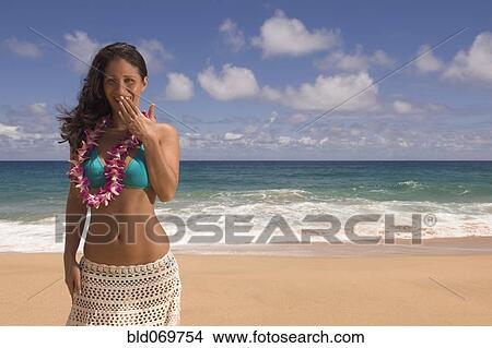 Pacific Islander woman laughing at beach View Large Photo Image Picture - Pacific Islander woman laughing at beach. Fotosearch