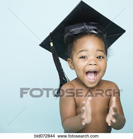 Portrait of African American girl wearing mortarboard View Large Photo Image Picture - Portrait of African American girl wearing mortarboard. Fotosearch