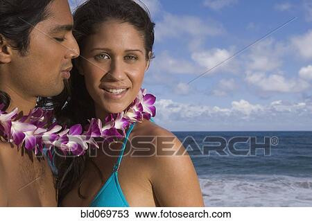 Portrait of couple wearing lei at beach View Large Photo Image Stock Image - Portrait of couple wearing lei at beach. Fotosearch