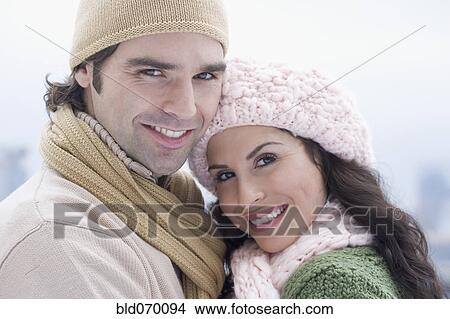 Portrait of Hispanic couple wearing winter clothing View Large Photo Image Picture - Portrait of Hispanic couple wearing winter clothing. Fotosearch