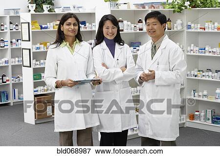 Stock Photo - Portrait of pharmacists in pharmacy. Fotosearch
