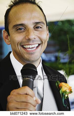 Russian man in tuxedo holding microphone View Large Photo Image Stock Image - Russian man in tuxedo holding microphone. Fotosearch