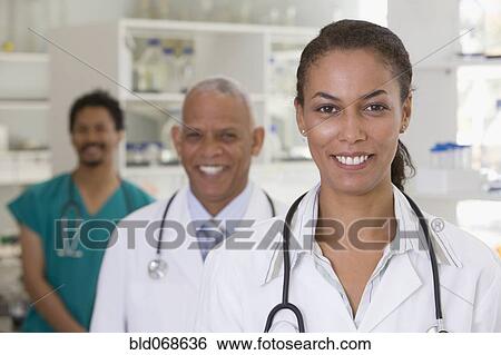 Smiling doctors in hospital laboratory View Large Photo Image Stock Photograph - Smiling doctors in hospital laboratory. Fotosearch