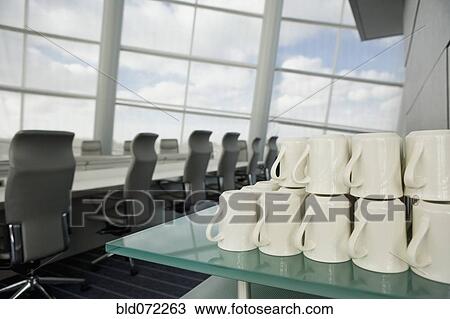 Stack of coffee mugs in conference room View Large Photo Image Stock Image - Stack of coffee mugs in conference room. Fotosearch
