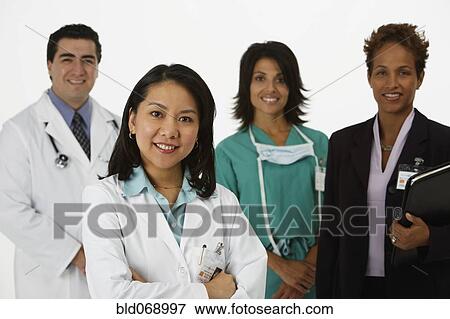 Stock Photo - Studio shot of doctors smiling. Fotosearch