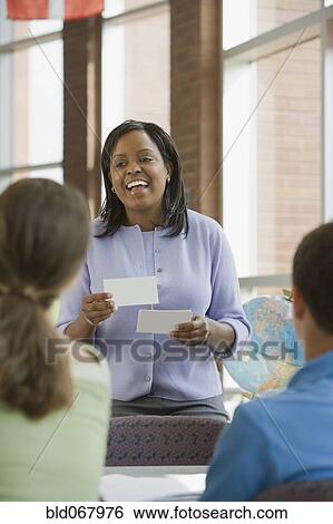 Stock Photograph - Teacher asking students questions. Fotosearch